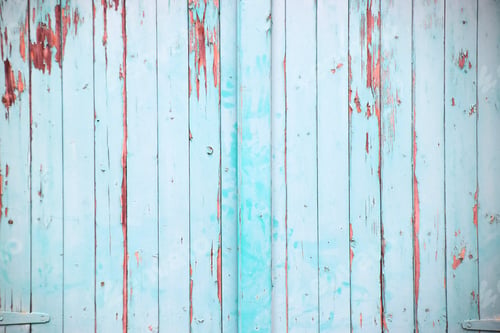Preview: painted and peeling wooden gate in light turquoise