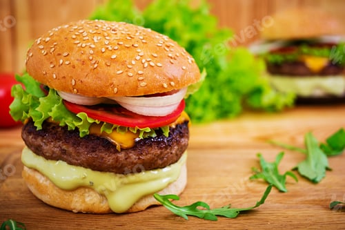 Preview: Delicious handmade burger on wooden background. Close view