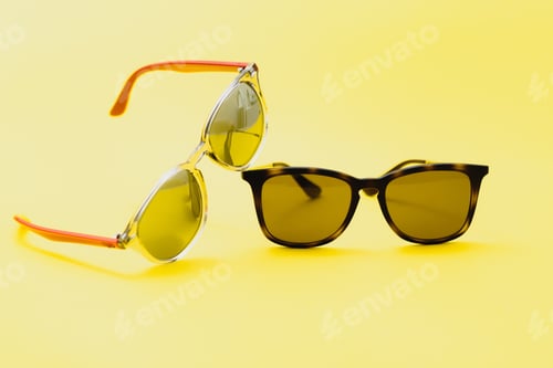 Preview: Stylish sunglasses on a yellow background High quality photo Sunglasses.