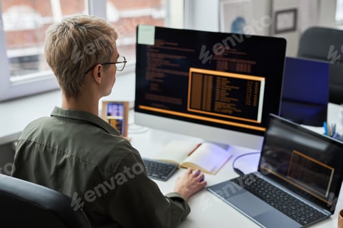 Preview: Programmer working on computer with codes