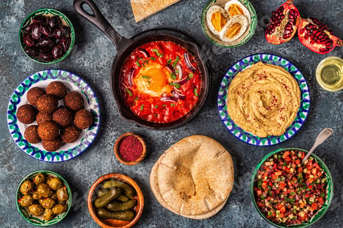 Preview: Falafel, hummus, shakshuka, Israeli salad - traditional dishes of Israeli cuisine.