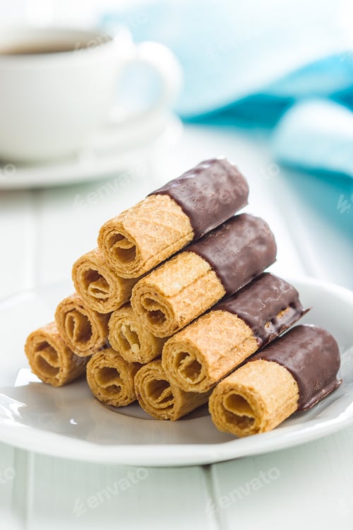 Preview: Sweet dessert. Biscuits rolls with chocolate icing.