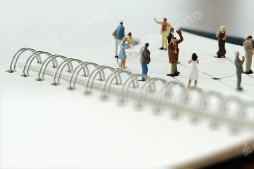 Preview: Close Up Of Miniature People With Social Network Diagram On Open Notebook On Wooden Desk As Social