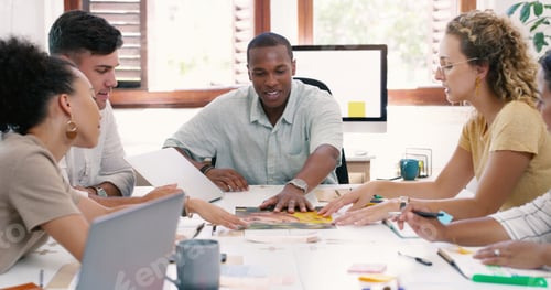 Preview: Shot of a group of young businesspeople having a meeting in a modern office