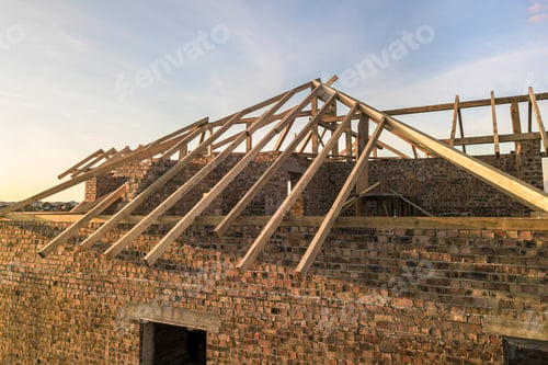 Preview: Private residential house with wooden roof frame structure under construction. Unfinished brick