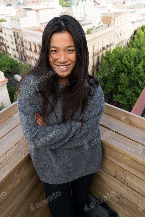 Preview: Pretty young woman posing on terrace