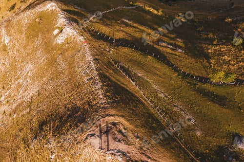 Preview: Two hikers shadow from above