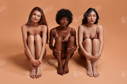 Preview: Multiethnic women on beige background