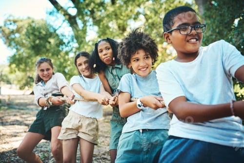 Preview: Shot of a group of teenagers playing a game of tug of war at summer camp