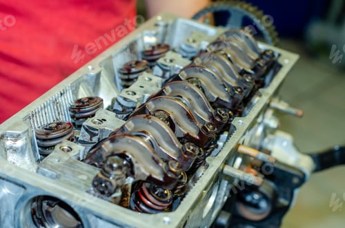 Preview: Closeup shot of disassemble engine head combustion chamber with dirty valves