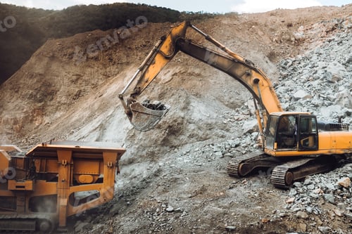 Preview: Industrial track type excavator digging and loading rock crusher at a quarry
