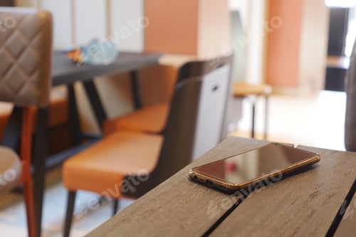 Preview: forget smartphone on a cafe table , lost smart phone