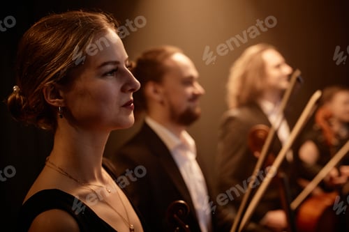 Preview: Young Woman on Stage with Orchestra