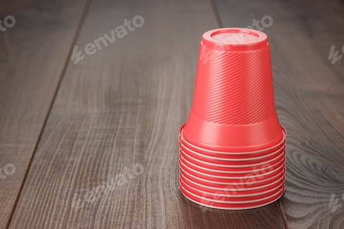 Preview: Stack Of Red Plastic Cups On The Table