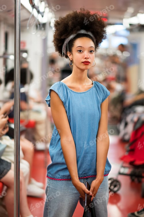 Preview: Trendy young ethnic female passenger commuting by train