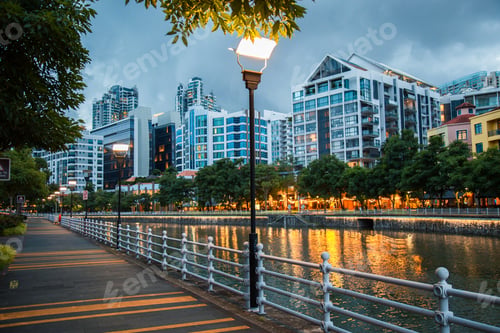 Preview: General view from Singapore skyscrapers and flats among green streets during twilight