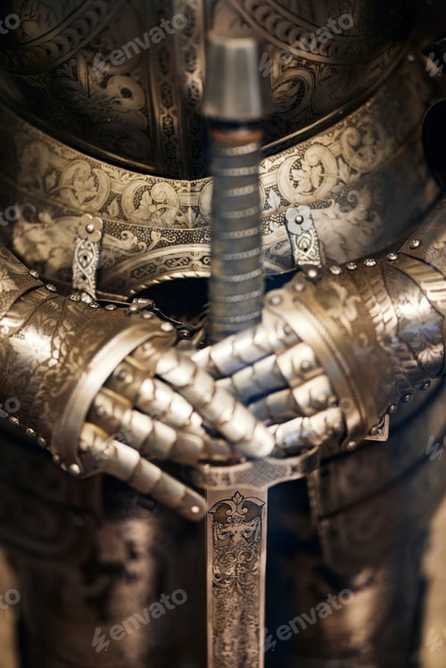 Preview: Closeup vertical shot of an armor replica with hands holding a swan in the City of Prague