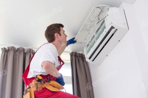 Preview: the worker connecting a new air conditioner unit