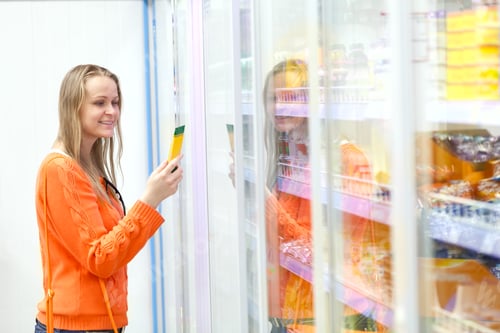 Preview: Woman taking product from the showcase