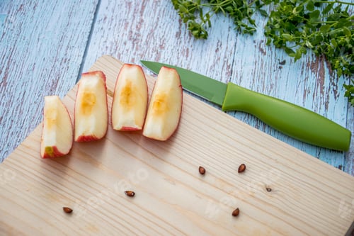 Preview: Organic ripe apples on a wooden table and apple slices on wooden board. Fresh cut apple