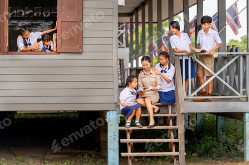 Preview: Woman teacher teach and train her student in area of steps of the building with some student
