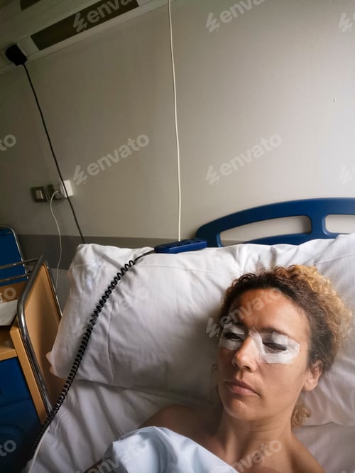 Preview: Caucasian woman patient in hospital after blepharoplasy surgery