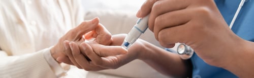 Preview: cropped view of multiracial nurse taking blood sample of senior woman with lancet pen, banner