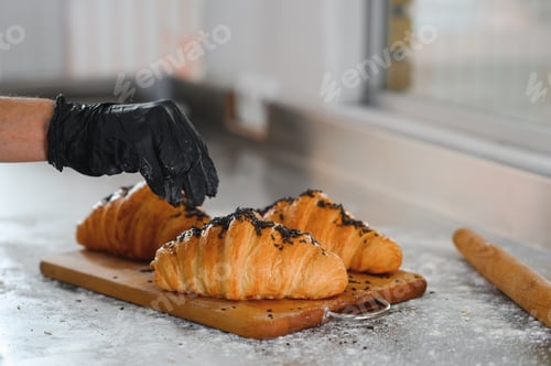 Preview: The baker decorates the finished croissants