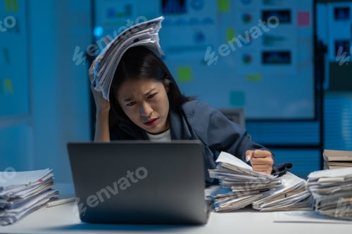 Preview: Stressed businesswoman at night in office, overwhelmed by paperwork, shows burnout and work-life