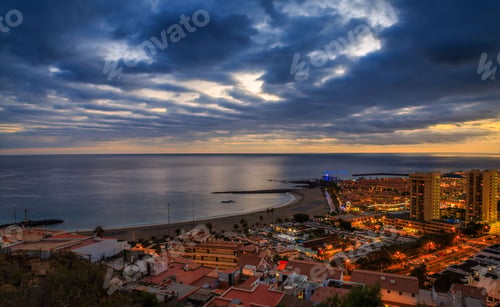 Preview: the sunset illuminates the coastline and the buildings