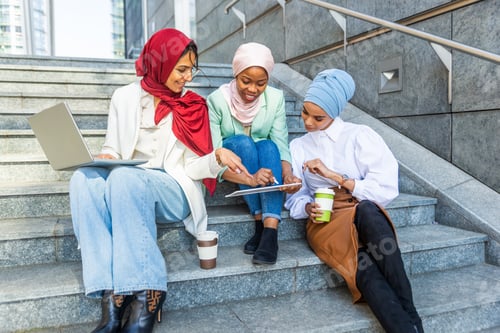 Preview: Beautiful muslim girl wearing hijab bonding outdoors