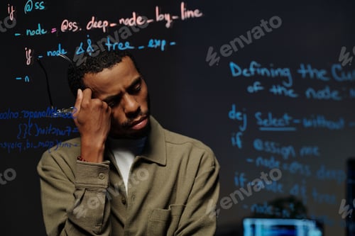 Preview: Pensive Developer Reading Code on Transparent Screen