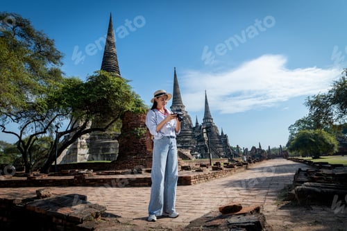 Preview: Portrait pretty young woman pose wearing beautiful dresses having fun and happy in famous the ancien