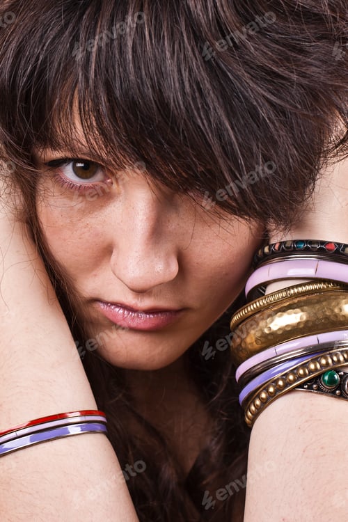 Preview: Brunet woman with bracelets.