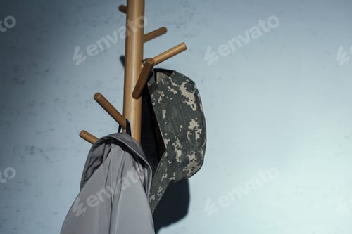 Preview: Coat and Hat Hanging on Wooden Coat Rack