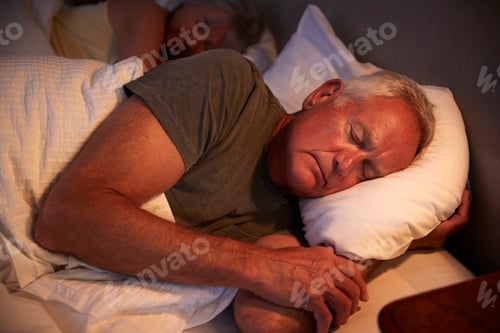 Preview: Peaceful Senior Man Asleep In Bed At Night