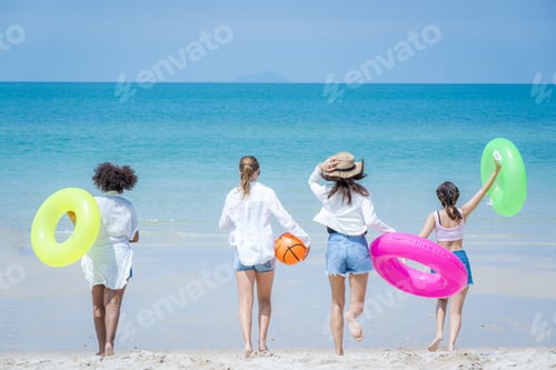 Preview: Pretty slim girls at tropical sea beach.