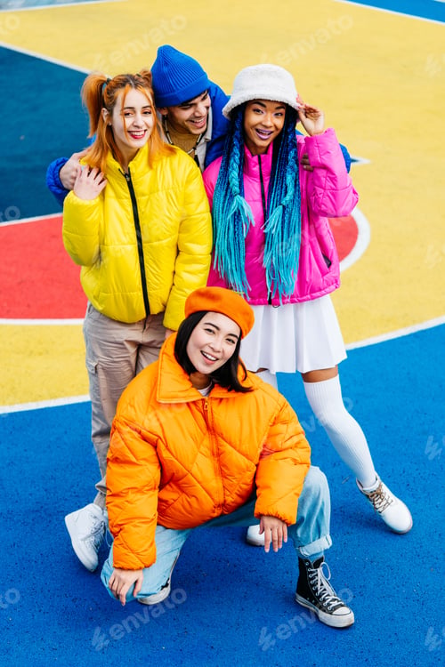 Preview: Multiracial group of young friends meeting outdoors in winter
