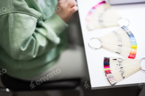 Preview: Manicure master working with female client in beauty salon.
