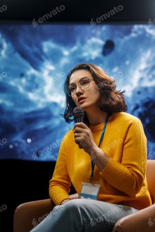 Preview: woman is giving a presentation at conference