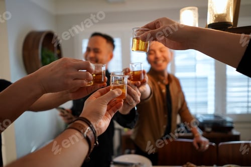 Preview: Friends taking a shot of whiskey. Partying.