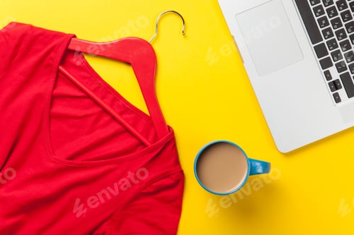 Preview: Flatlay of Work Accessories on Yellow Surface