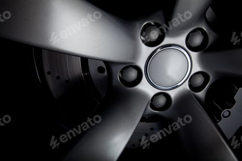 Preview: Picture Of A Black Car Tire With Focus On Bolts