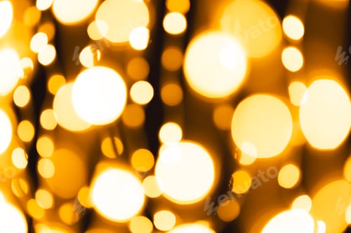 Preview: Multiple yellow bokeh lights with copy space on dark background