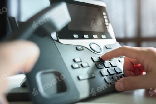 Preview: Dialing a telephone in the office