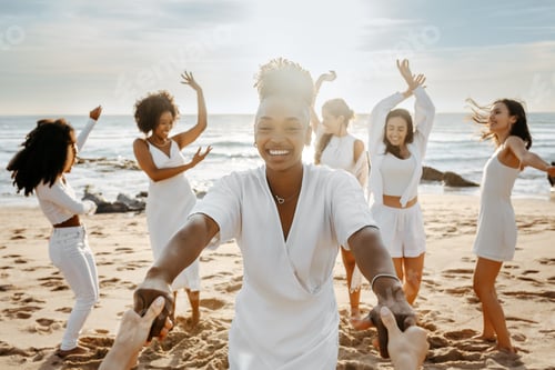 Preview: Diverse group of happy young female friends having fun outdoors on the beach, women celebrating hen