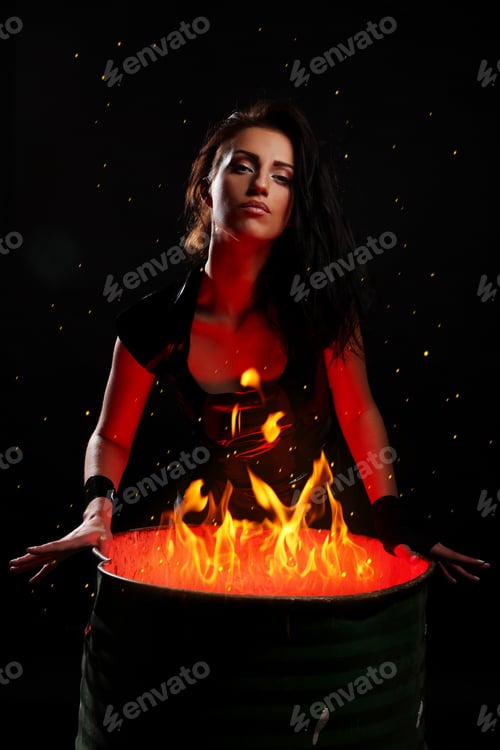 Preview: Beautiful woman and iron barrel with fire inside