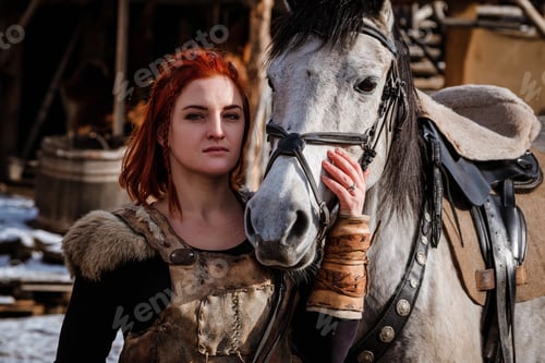 Preview: Red-haired woman with a faithful horse preparing for battle