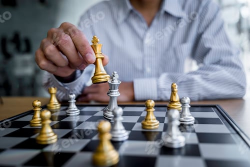Preview: Businessman playing chess game reaching to plan a strategy for success, thinking for planning overco