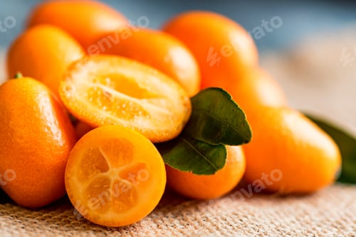 Preview: Kumquat or cumquat on wooden table